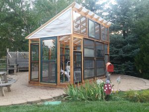 wood greenhouse, slant roof, glass windows